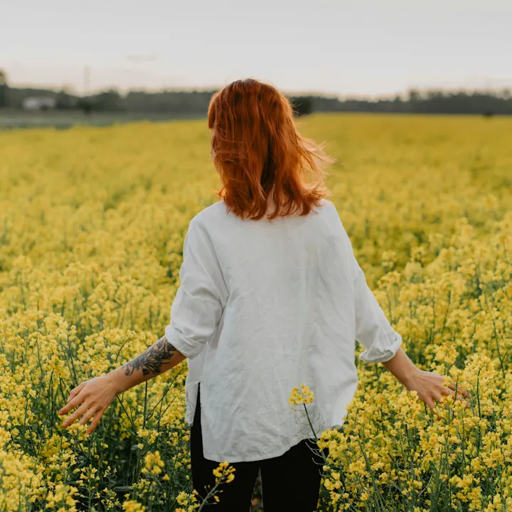 lady in field of flowers